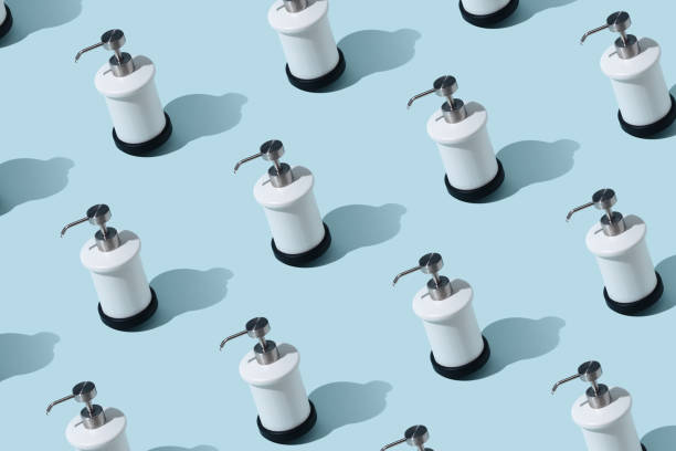 istock Dispenser for liquid soap on a blue background. 1219448662