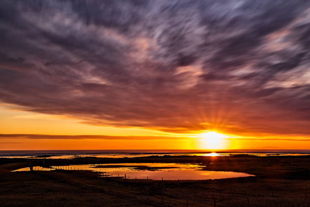 istock Colorful sunset reflected in the water 1219450793