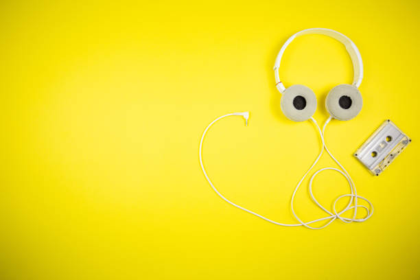 istock Audio cassette tape and modern headphones 1219453172