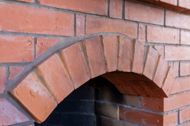 istock fireplace arch laid out of bricks semi-circle close-up background design 1219453349