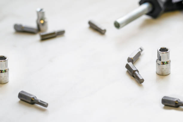 istock placer of replaceable iron bits for changing nozzles for a screwdriver on a light background, selective focus 1219454475