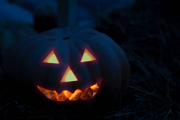 istock halloween pumpkin devilish burning smile design flashlight jack out of darkness 1219455289