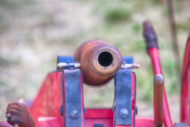 istock old and rusty cannon barrel closeup lies on a red carriage 1219455745