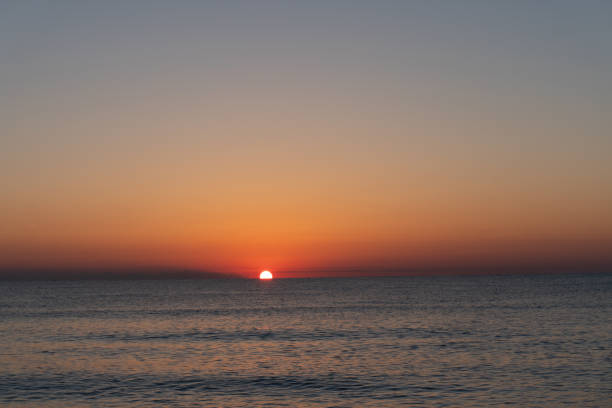 istock sunrise at the beach 1219456307