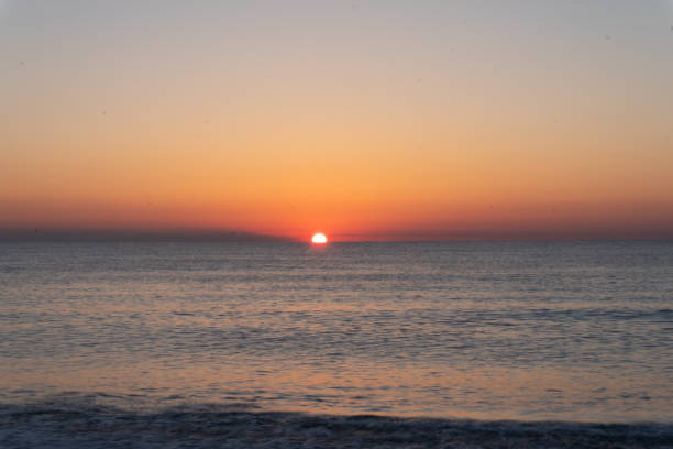 istock sunrise at the beach 1219456358