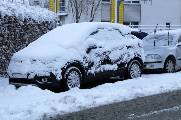 A Car covered with fresh white snow stock photo