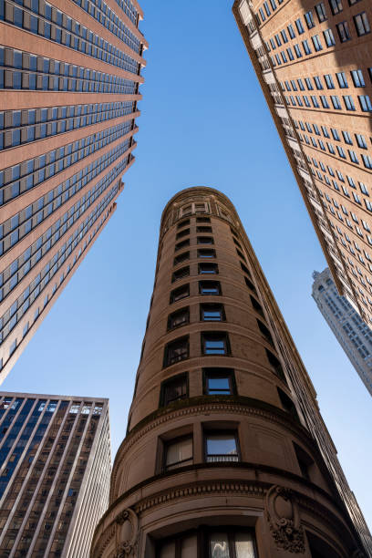 istock Corporate building against the blue sky. Low angle looking up photo. 1219459118