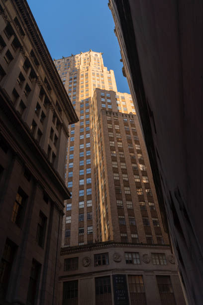 istock Corporate building against the blue sky. Low angle looking up photo. 1219459120