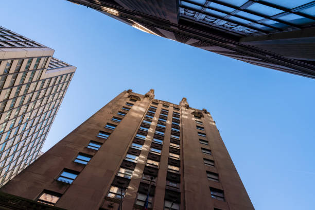 istock Corporate building against the blue sky. Low angle looking up photo. 1219459127