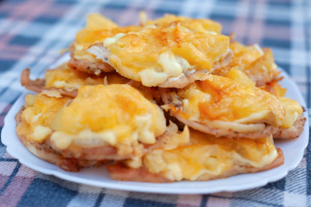 Delicious potato chips with pepper on a white plate. Vegetarian food. Fast food.