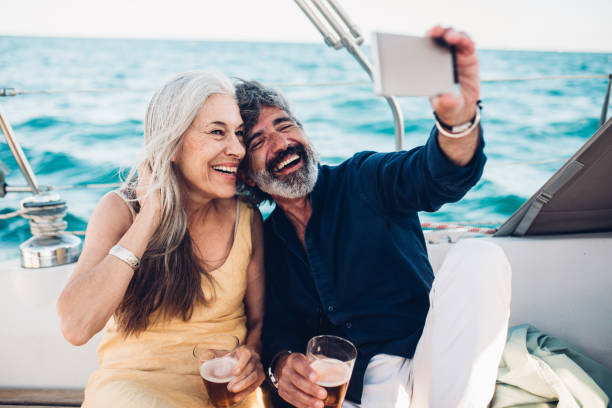 istock Seniors taking a selfie while cruising on their yacht 1219461710