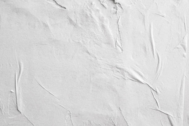 istock Blank white crumpled and creased paper poster texture background 1219461715