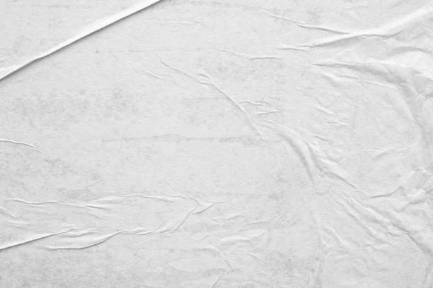 istock Blank white crumpled and creased paper poster texture background 1219461722