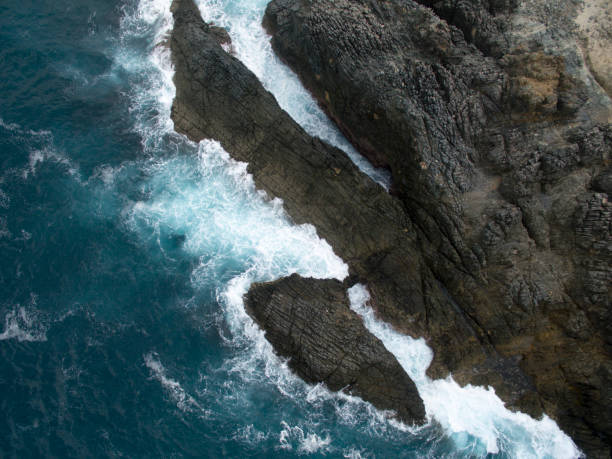 istock Aerial view sunset over sea, ocean waves crashing on beach 1219462418