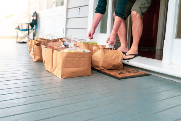 istock Man receiving online purchases during quarantine period. 1219463342
