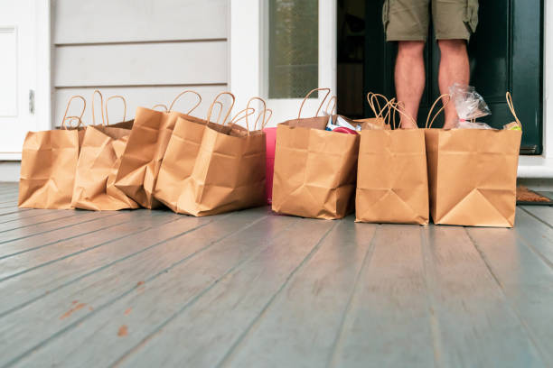 istock Man receiving online purchases during quarantine period. 1219463343