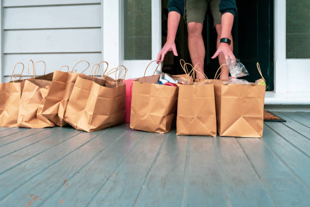 istock Man receiving online purchases during quarantine period. 1219463344