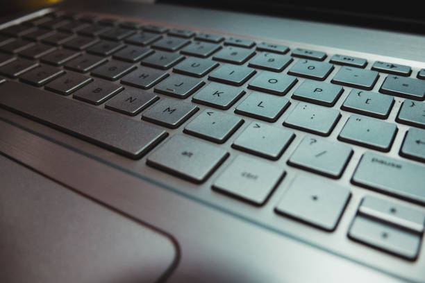 istock photo laptop computer keyboard with the surface of the mouse 1219463348