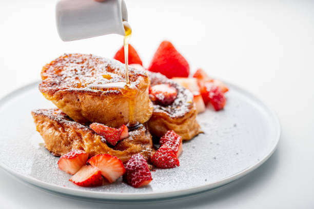 french toast with fresh strawberries and honey syrup on white plate. - japanese maple imagens e fotografias de stock