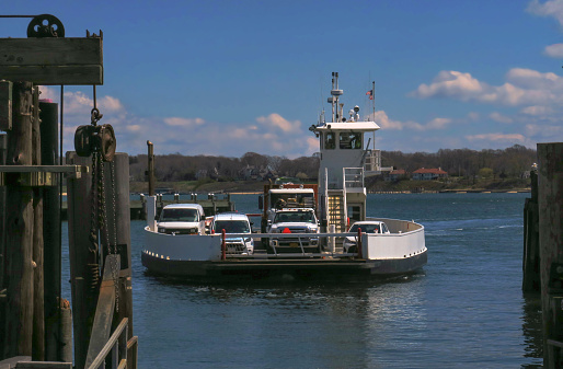 car ferry from Shelter Island, NY approaching the terminus dock in Greenport, NY on the Peconic Bay on Long Island