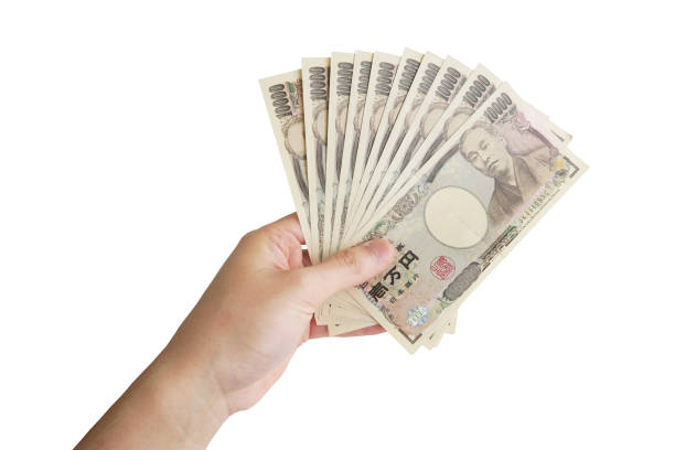 die hand eines mannes hält 100.000 yen - weißer hintergrund - japanischer yenschein stock-fotos und bilder
