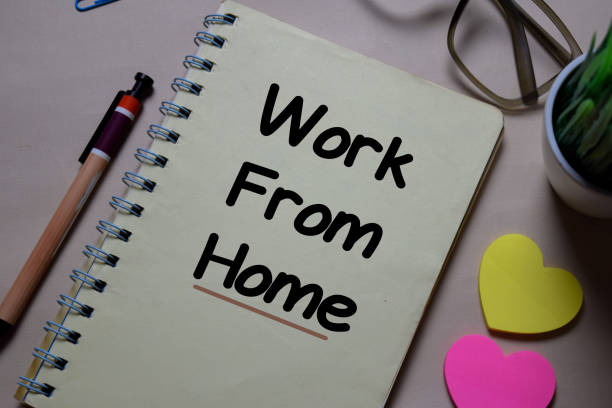 istock Work from home write on a book isolated on Office Desk 1219481938