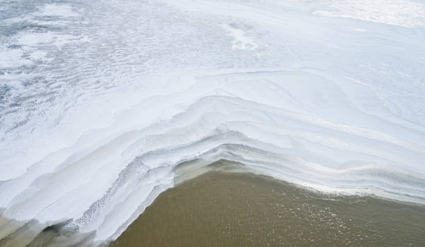 istock The lakeshore is covering with snowflakes 1219486298