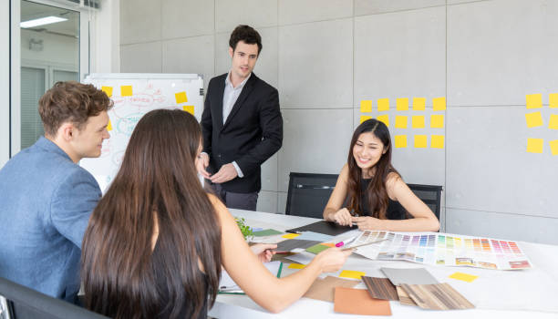 istock Designer team discussion on meeting desk 1219487696