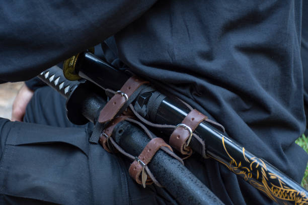 istock Katana sword in a warrior or ninja hand 1219488263