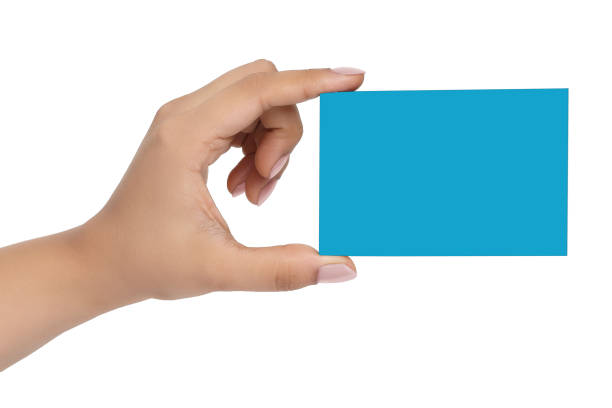 istock Female hand with a Blue card isolated 1219490236