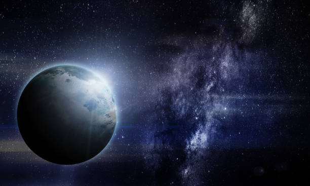 istock abstract space illustration, 3d image, planet in space in the radiance of stars, eclipse 1219490312