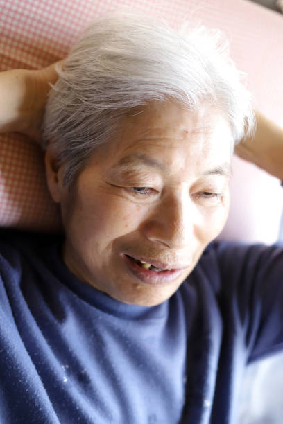 istock Senior lady lying on the nursing care bed 1219491908