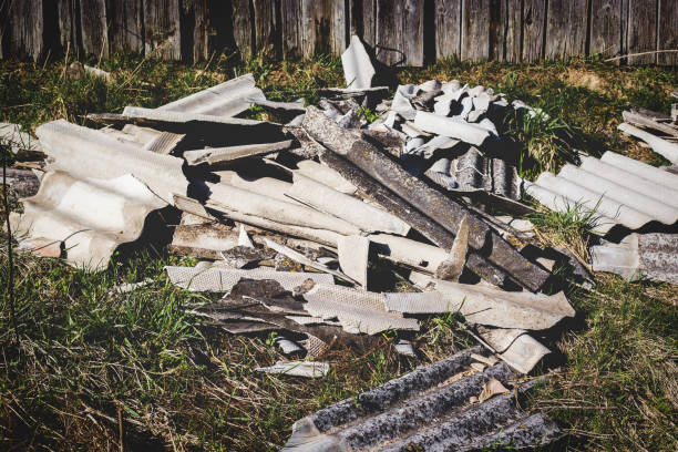 istock Asbestos roof removal . Asbestos dust in the environment. Health problems 1219497903