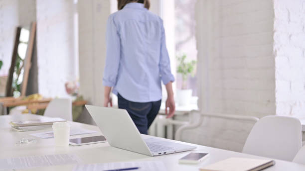 istock Beautiful Young Woman Standing up and Going Away 1219498623