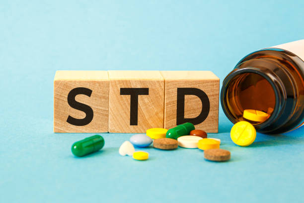 STD Sexually transmitted infections text on wooden cubes. stock photo