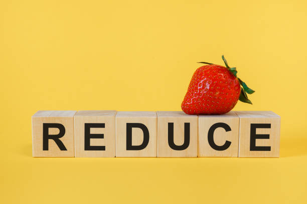 istock Reduce Word Written In Wooden Cube 1219498751