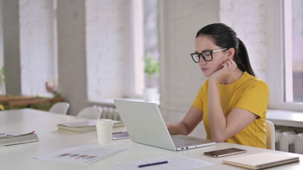 istock Sleepy Young Female Designer taking Nap in Modern Office 1219498868