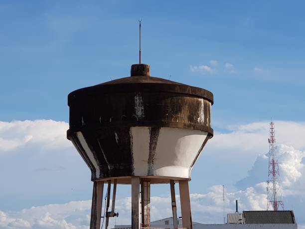 istock cement water tank and cloud and blue sky 1219501175