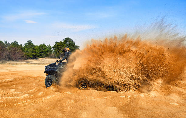 istock Racing in the sand on a four-wheel drive quad. 1219504398
