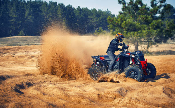 istock Racing in the sand on a four-wheel drive quad. 1219505148