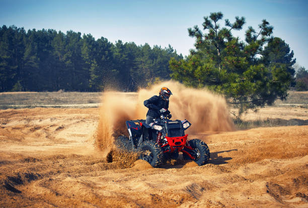 istock Racing in the sand on a four-wheel drive quad. 1219505149
