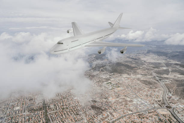 istock airplane flying over a coast city 1219506705