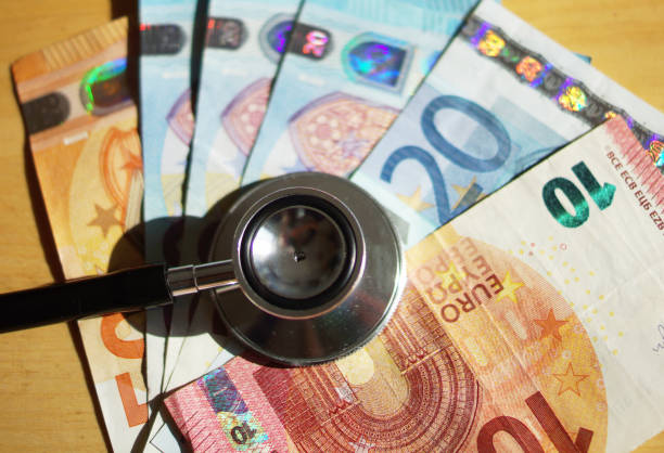 istock Stethoscope and Euro money notes. 1219508215
