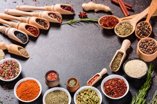 istock Pepper, salt, paprika, basil and other on a dark background 1219510084