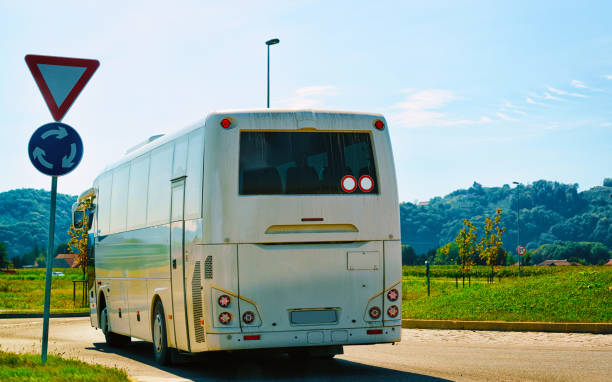 istock White Tourist bus on road in Poland 1219510099