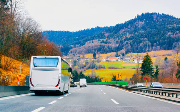 istock White touristic bus in road on highway 1219510190