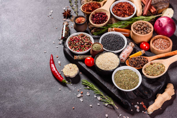 istock Pepper, salt, paprika, basil and other on a dark background 1219510311