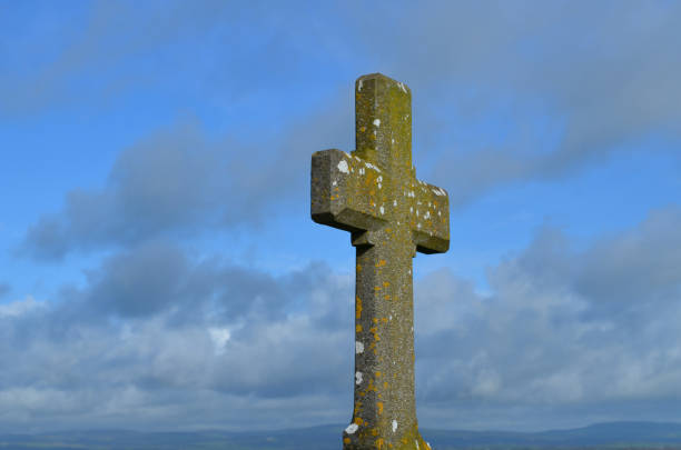 istock Stone Cross Against a Blue Sky in Ireland 1219510691