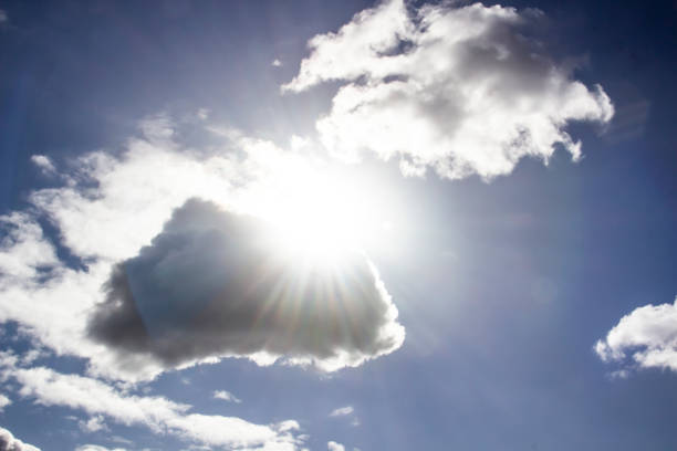 istock Clouds in the blue sky with a sun light. A miracle Gods light against background. Pattern from clouds in the sky. 1219512694