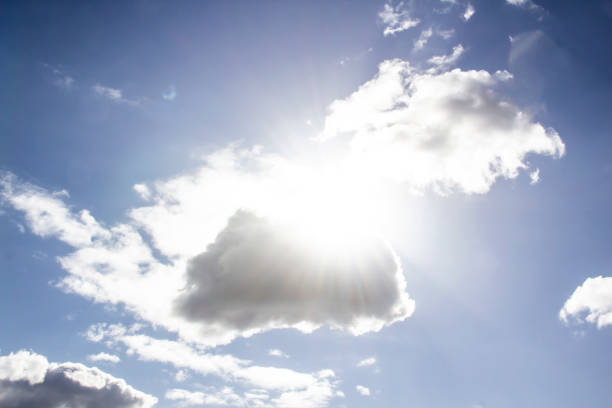 istock Clouds in the blue sky with a sun light. A miracle Gods light against background. Pattern from clouds in the sky. 1219512697
